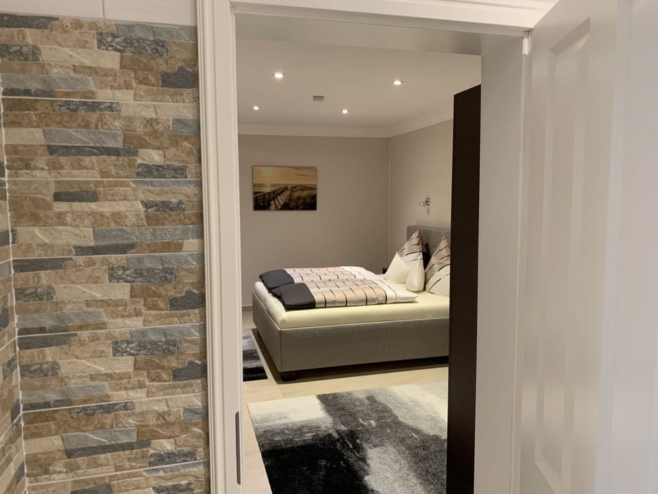 Comfort Suite, 2 Queen Beds, Non Smoking, Courtyard View | Living area | 55-inch flat-screen TV with satellite channels, TV, iPod dock