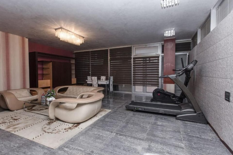 Luxury Apartment, Multiple Beds | Living area | Flat-screen TV, DVD player, streaming services