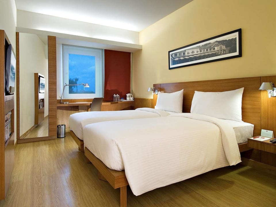 Premium bedding, down comforters, minibar, in-room safe