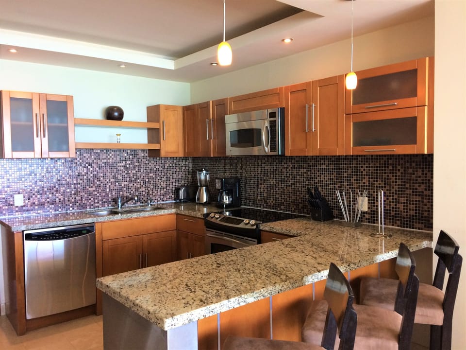 Family Condo, 2 Bedrooms | Private kitchen | Full-size fridge, microwave, oven, stovetop
