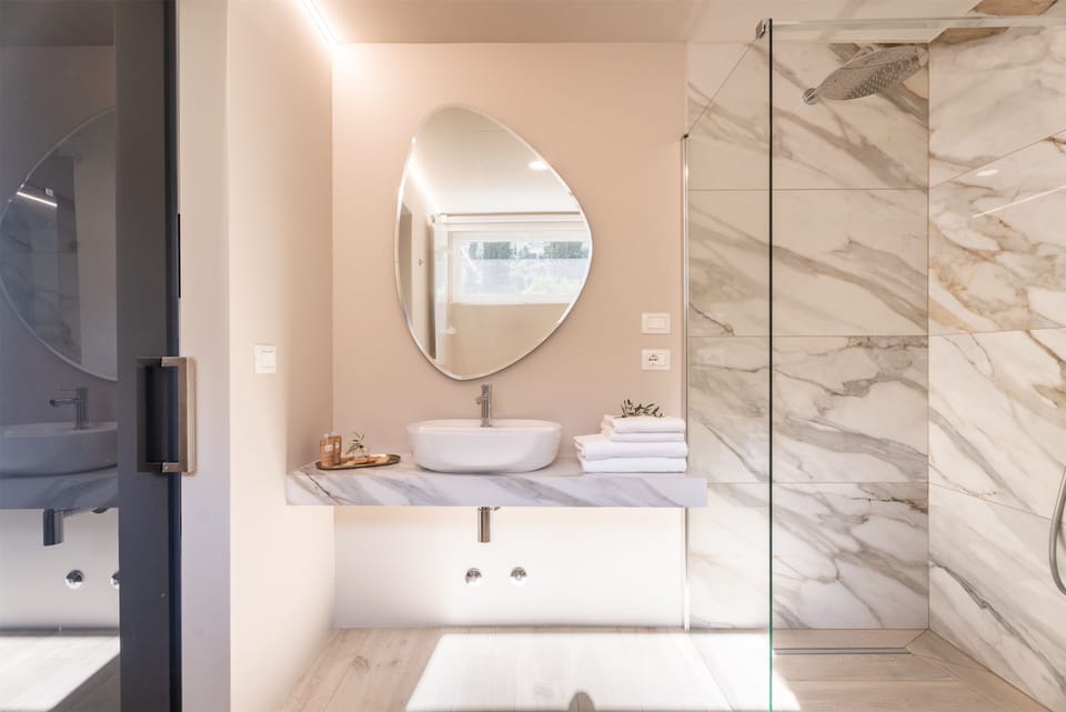 Superior Room, Balcony, Partial Lake View | Bathroom | Combined shower/tub, hair dryer, towels