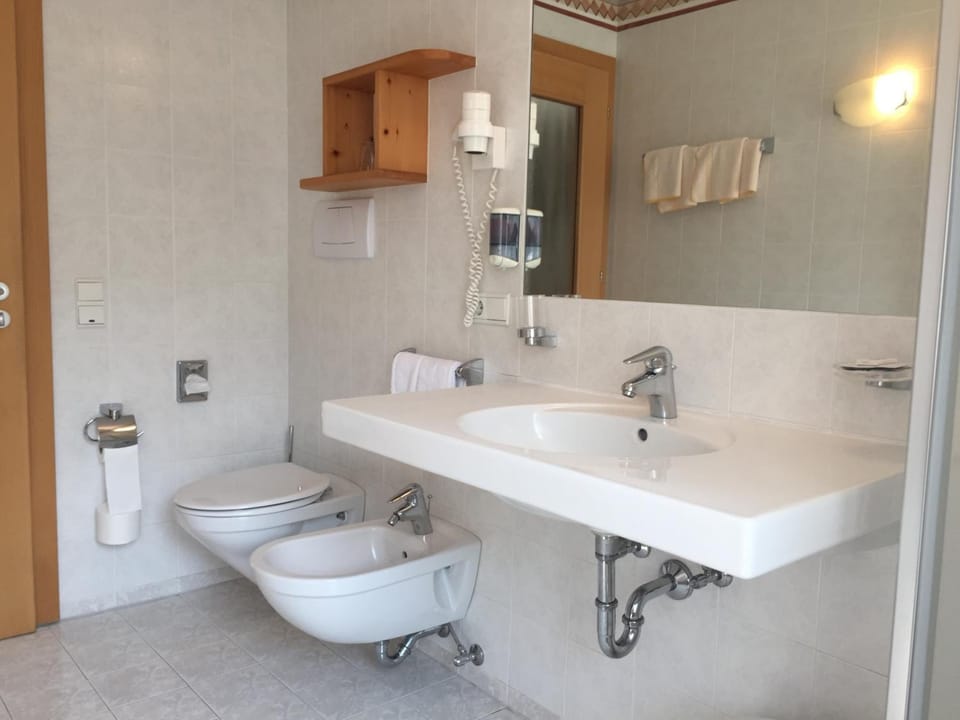 Deep soaking tub, rainfall showerhead, hair dryer, bidet