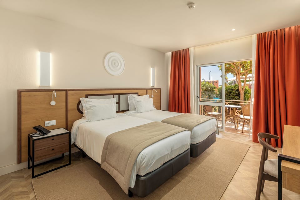 Twin Room, Pool View | In-room safe, desk, blackout drapes, iron/ironing board