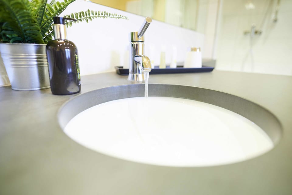 Deluxe Double Room, Non Smoking | Bathroom | Designer toiletries, hair dryer, towels, soap