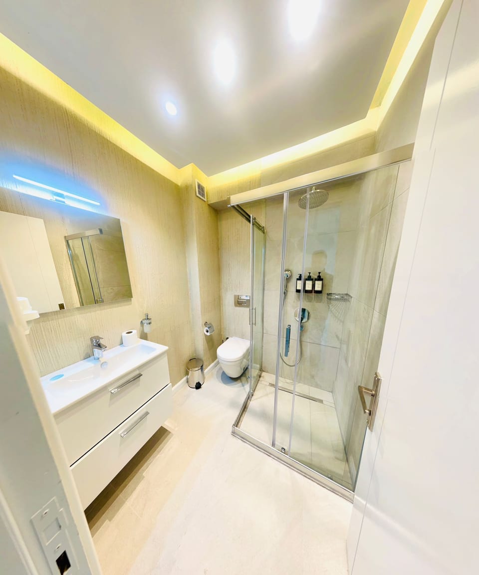 Shower, free toiletries, hair dryer, slippers