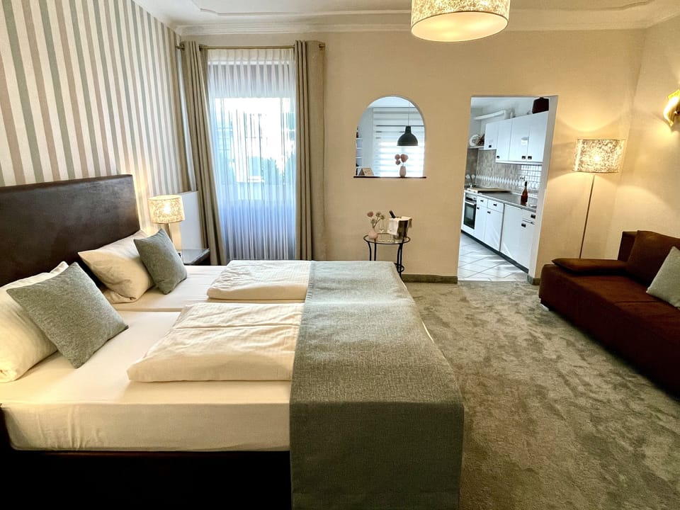 Down comforters, pillowtop beds, in-room safe, desk