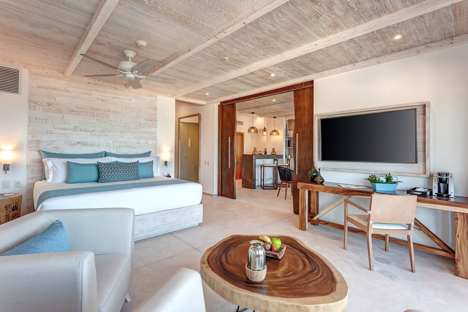Presidential Ocean Front One Bedroom Suite | Minibar, in-room safe, blackout drapes, iron/ironing board