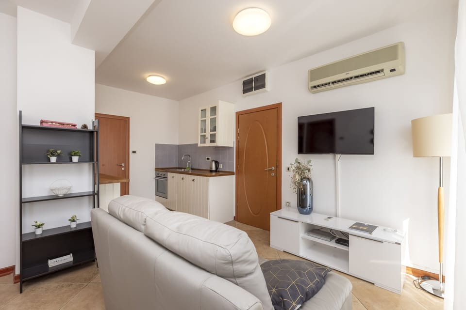 Family Apartment | Living room | 70-cm LCD TV with satellite channels, TV, foosball