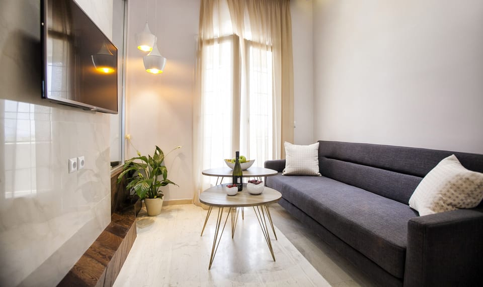 Suite, Jetted Tub | Living room | 42-inch LED TV with satellite channels, TV