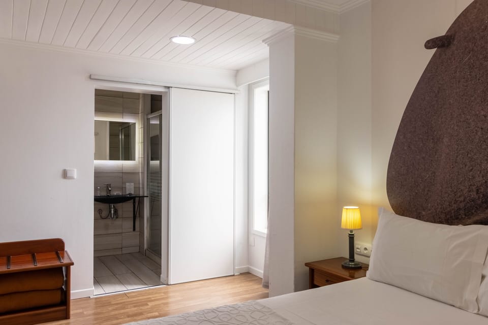 Standard Double Room | Minibar, in-room safe, individually decorated, desk