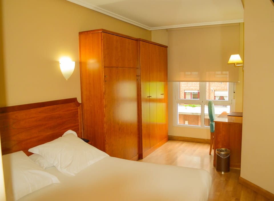 Double Room | Minibar, in-room safe, desk, iron/ironing board
