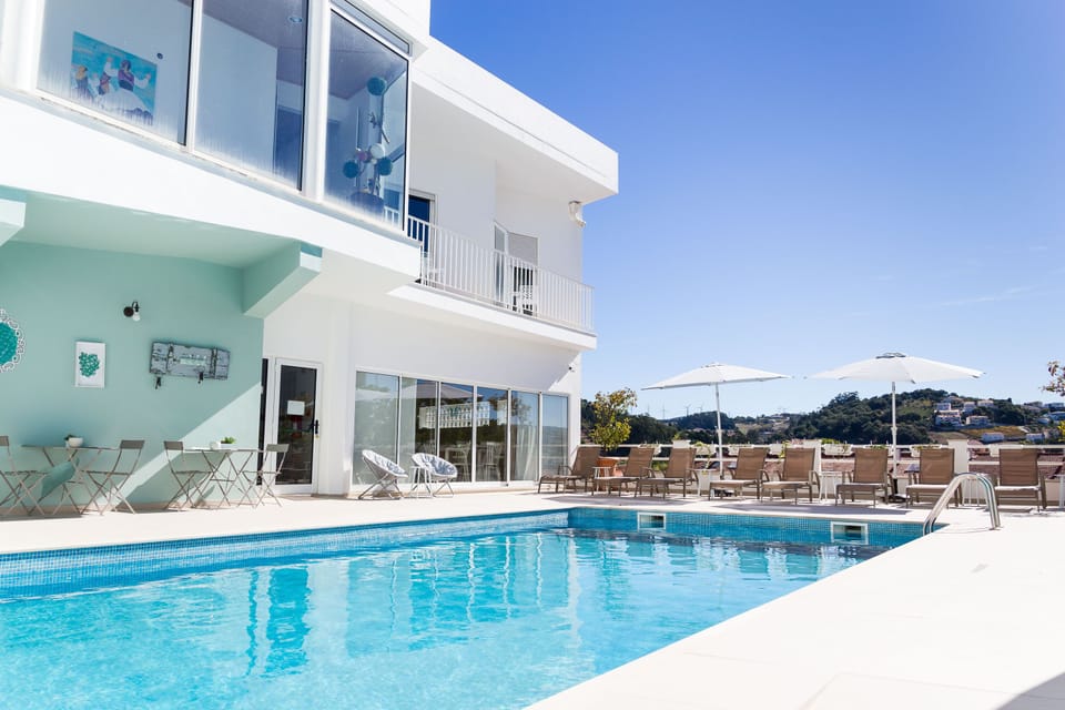 Indoor pool, seasonal outdoor pool, pool umbrellas, sun loungers