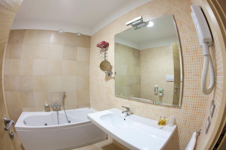 Shower, free toiletries, hair dryer, slippers