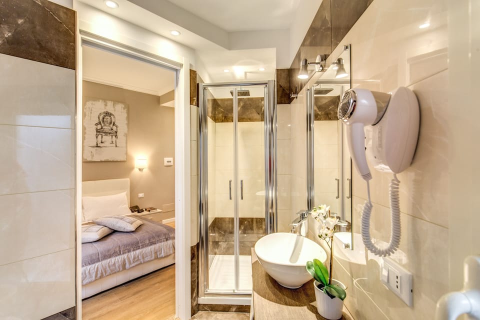Shower, free toiletries, hair dryer, slippers