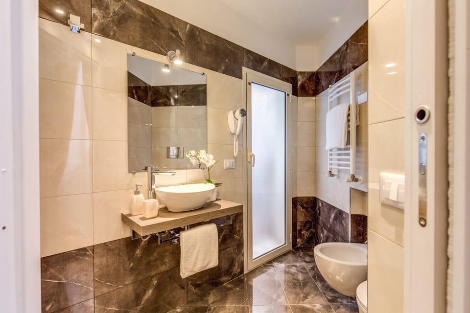 Shower, free toiletries, hair dryer, slippers