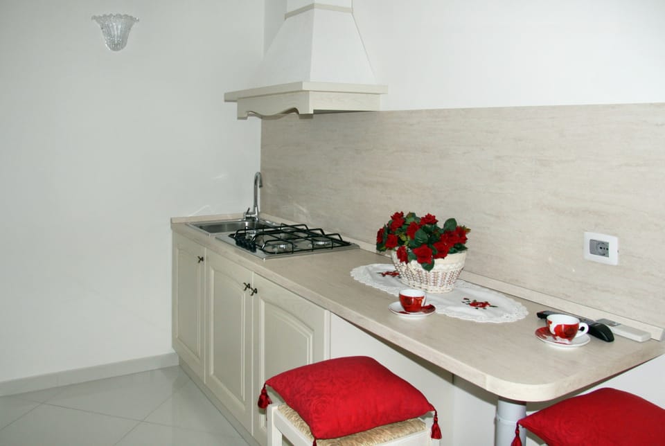 Quadruple Room | Private kitchenette | Fridge, coffee/tea maker, electric kettle