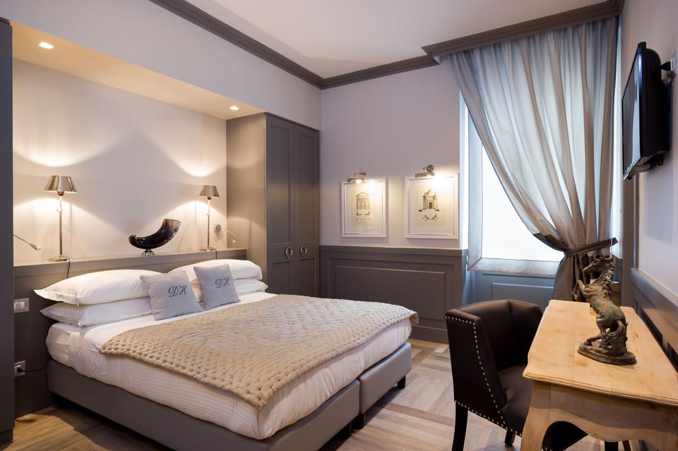 Premium bedding, down comforters, memory foam beds, minibar