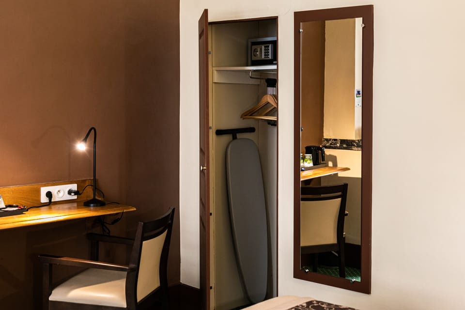 Premium bedding, desk, laptop workspace, blackout drapes
