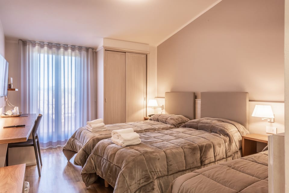 Classic Triple Room | Minibar, in-room safe, individually furnished, desk