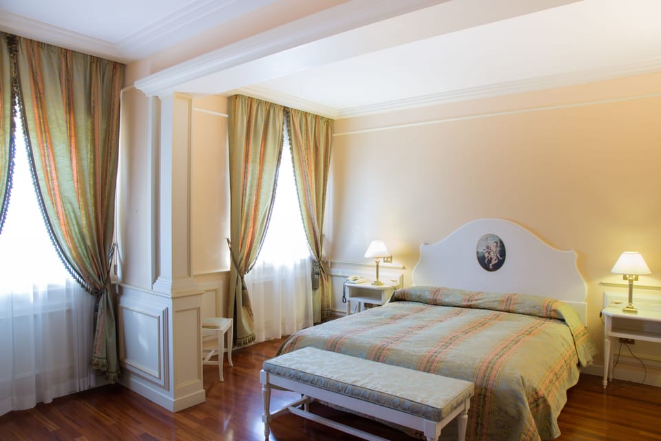 Deluxe Double Room | Minibar, desk, laptop workspace, blackout drapes