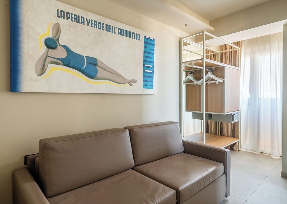 Suite, Sea View | Minibar, in-room safe, individually decorated, desk