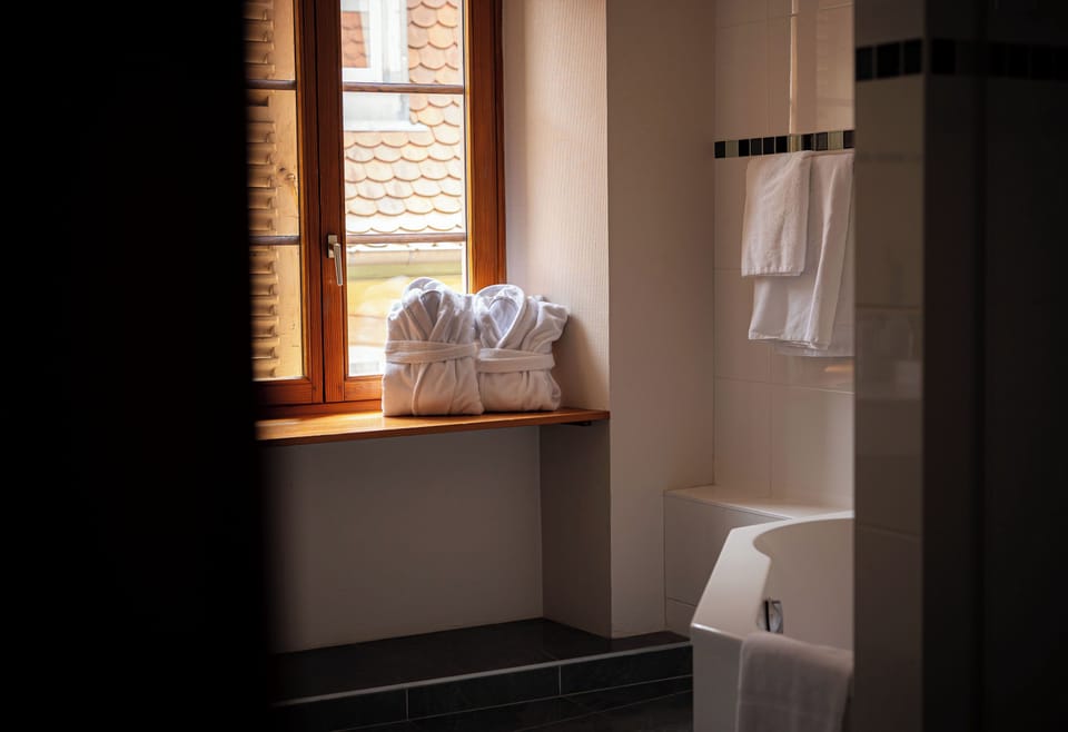Comfort Room | Bathroom | Designer toiletries, hair dryer, bathrobes, slippers