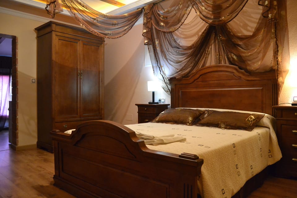 Suite, Jetted Tub (204 Cueva de la Encantada) | Desk, iron/ironing board (on request), WiFi (free), bed sheets