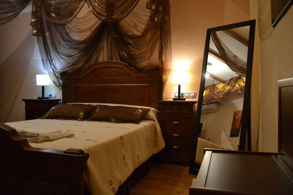 Suite, Jetted Tub (204 Cueva de la Encantada) | Desk, iron/ironing board (on request), WiFi (free), bed sheets