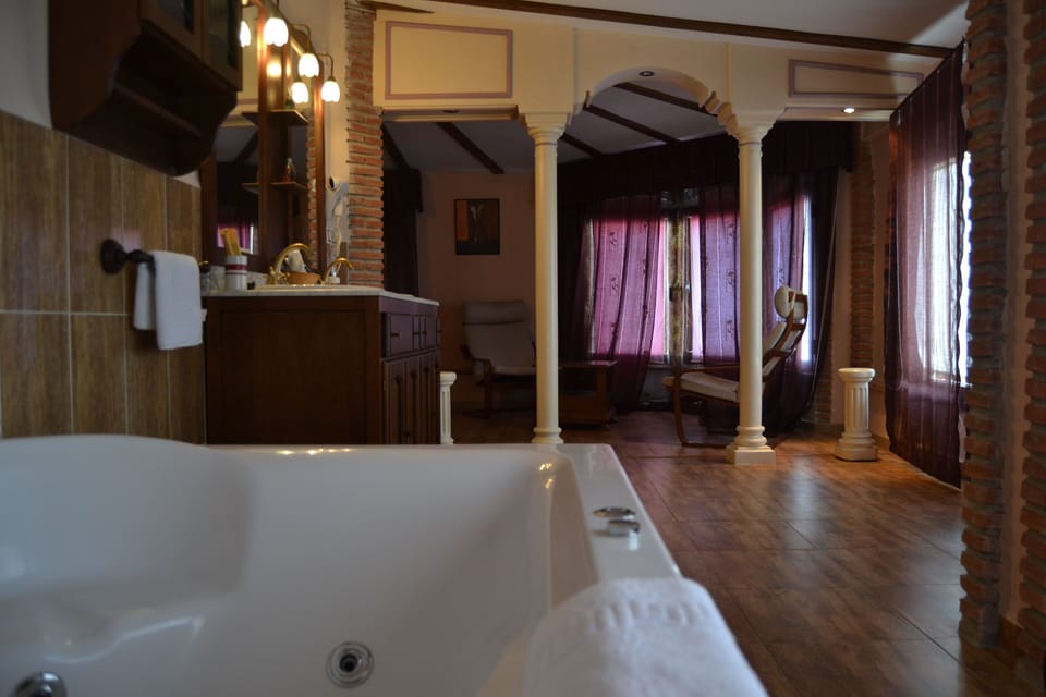 Suite, Jetted Tub (204 Cueva de la Encantada) | Living area | Flat-screen TV