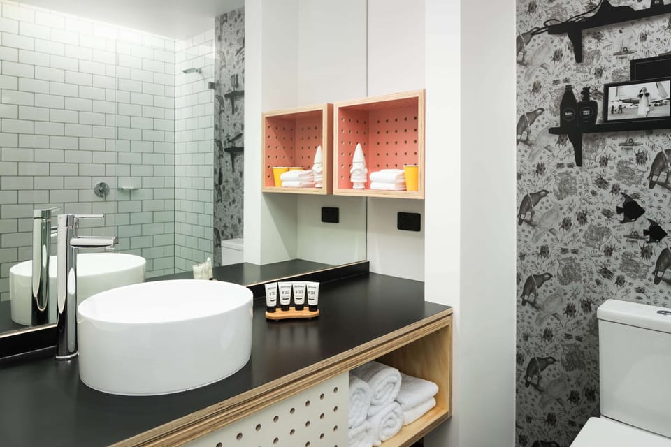 Shower, designer toiletries, towels