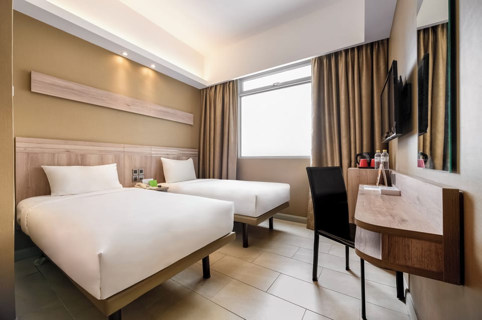Superior Twin Room | Minibar, in-room safe, desk, laptop workspace