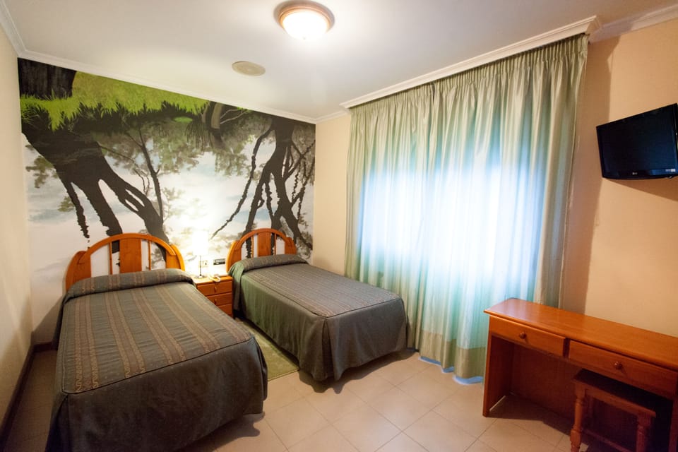 Double or Twin Room | Laptop workspace, iron/ironing board, free WiFi, bed sheets
