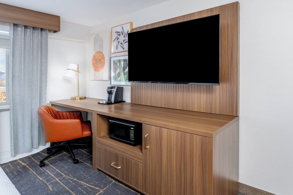 Desk, blackout drapes, iron/ironing board, free cribs/infant beds