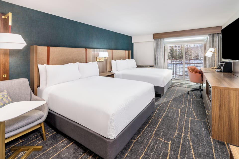 Desk, blackout drapes, iron/ironing board, free cribs/infant beds