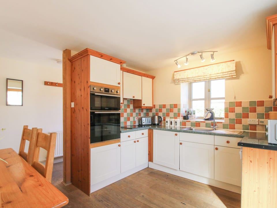 Fridge, dishwasher, highchair, cookware/dishes/utensils