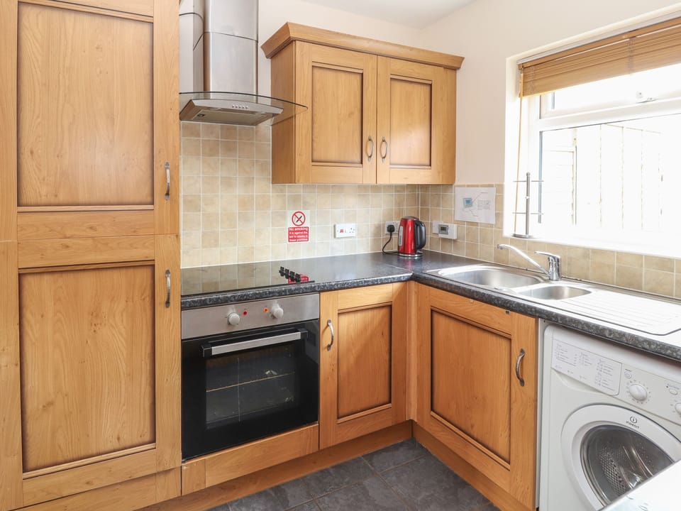 Cottage | Private kitchen | Fridge, oven, stovetop, highchair