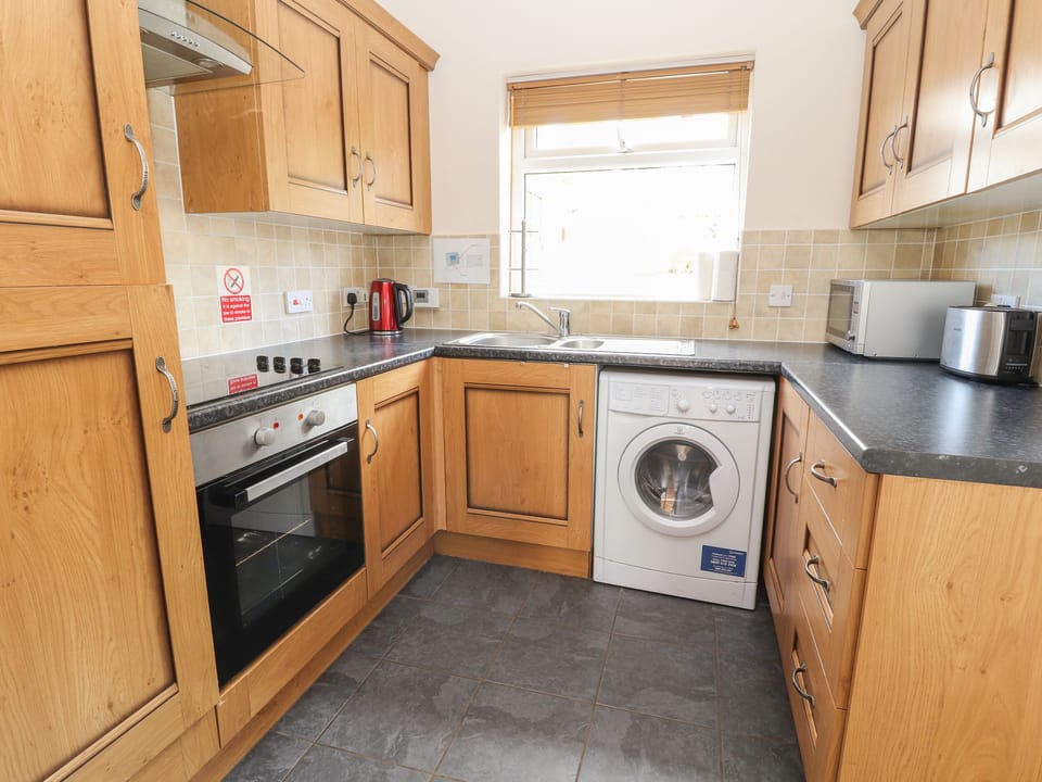 Cottage | Private kitchen | Fridge, oven, stovetop, highchair