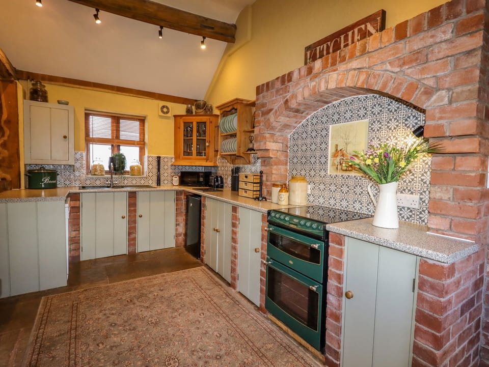 Cottage | Private kitchen | Stovetop, dishwasher, highchair, cookware/dishes/utensils