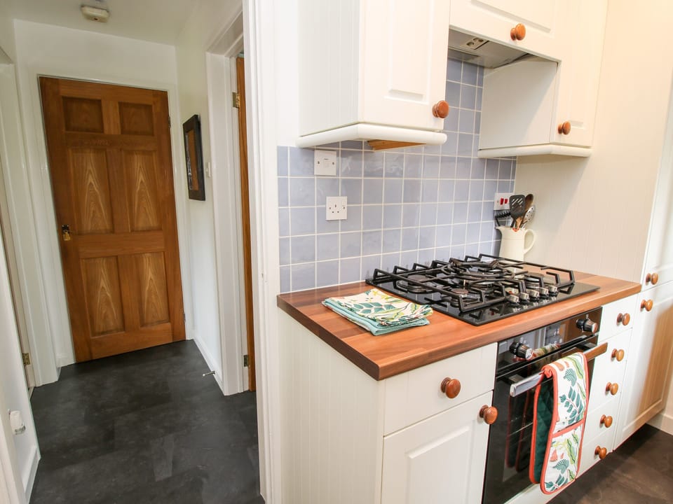 Cottage | Private kitchen | Stovetop, dishwasher, highchair, cookware/dishes/utensils