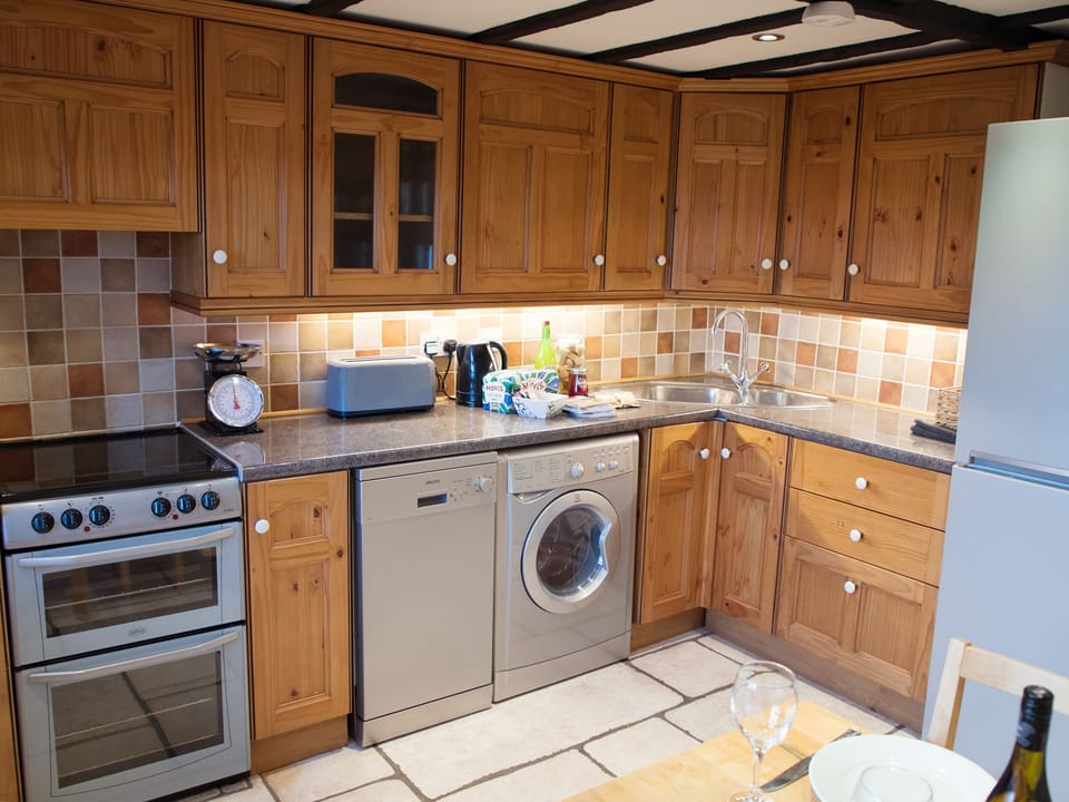 Cottage | Private kitchen | Stovetop, dishwasher, highchair, cookware/dishes/utensils