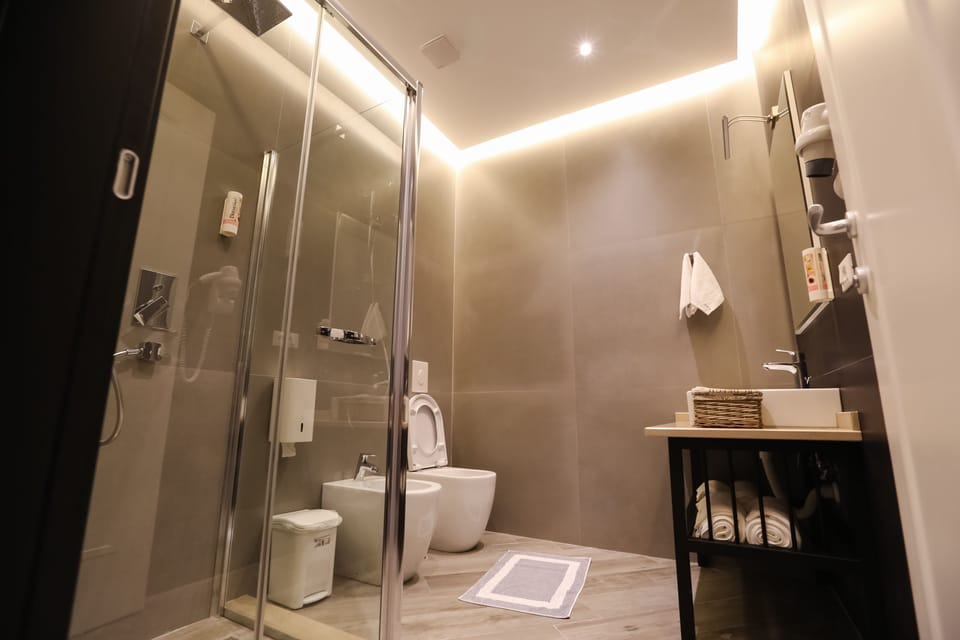 Family Comfort Suite with Double Bed, Single Bed, and Living Area | Bathroom | Free toiletries, hair dryer, bathrobes, slippers