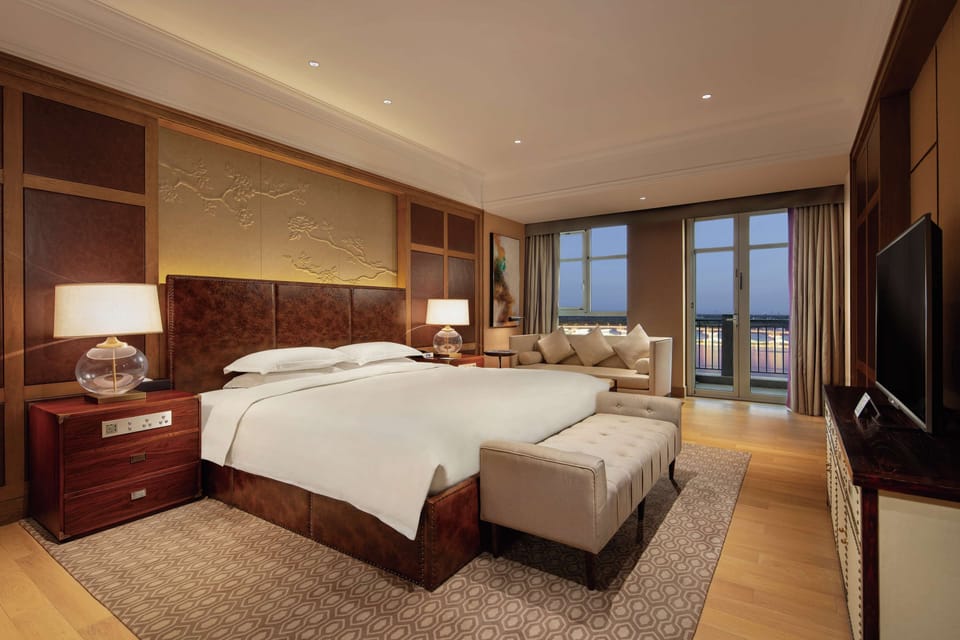Presidential Suite, 1 Bedroom | Living area | 49-inch TV with cable channels