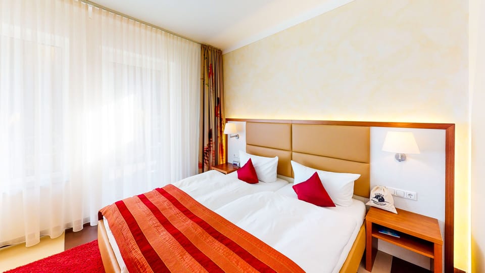 Premium bedding, down comforters, minibar, desk
