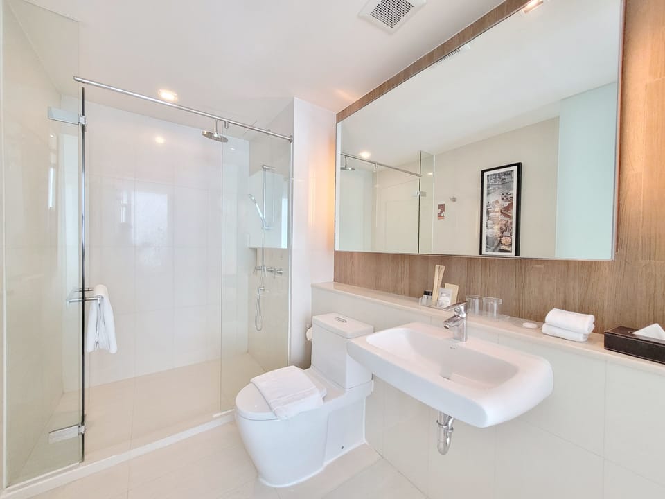 Shower, designer toiletries, hair dryer, bathrobes