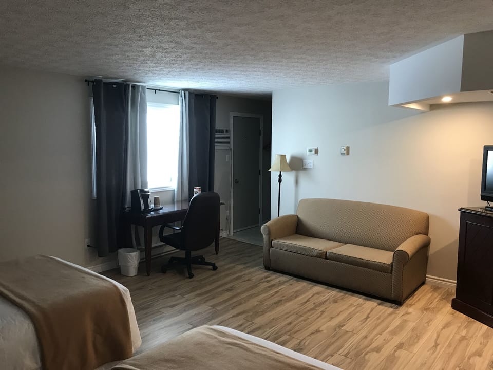 Standard Suite, Multiple Beds | Living area | 40-inch flat-screen TV with digital channels, Netflix