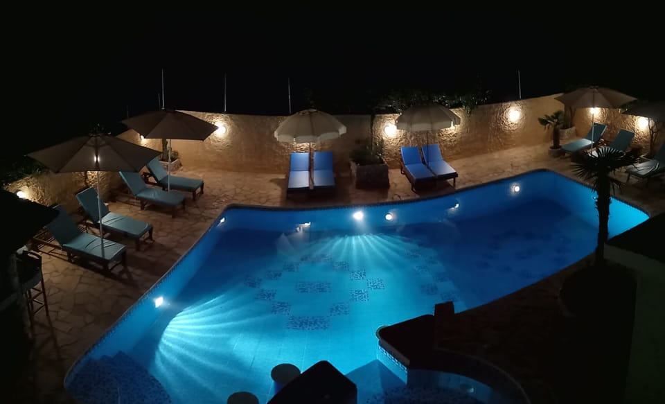 Outdoor pool, open 8 AM to 9 PM, pool umbrellas, sun loungers