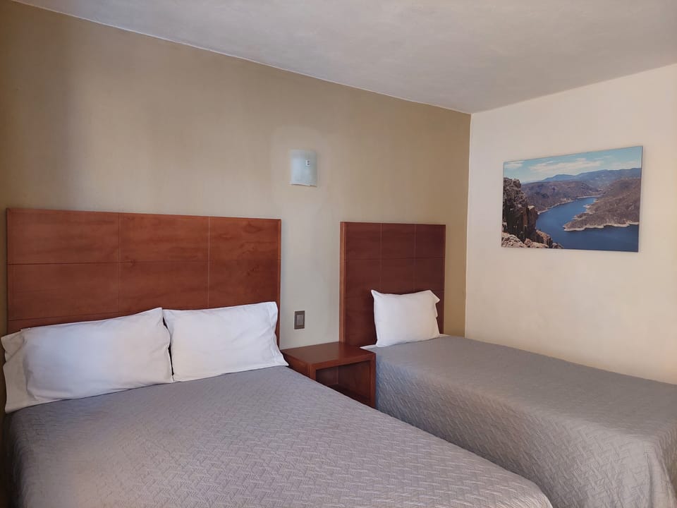 Triple Room, Multiple Beds | Individually furnished, desk, laptop workspace, iron/ironing board