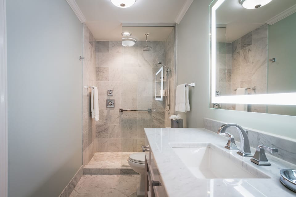 Shower, rainfall showerhead, designer toiletries, hair dryer
