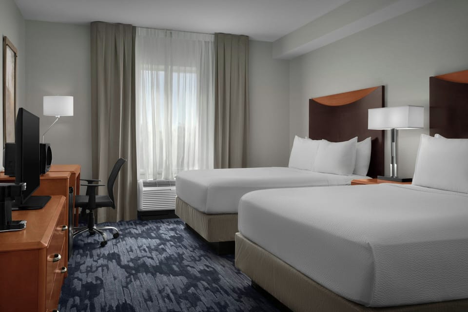 Hypo-allergenic bedding, desk, blackout drapes, iron/ironing board