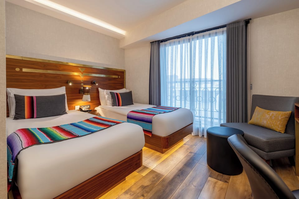 Standard Twin Room | Minibar, in-room safe, desk, soundproofing